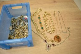 An assortment of costume jewellery, including brooches, statement pieces and neck chains