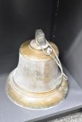 A George VI cast bronze/bell metal bell, of typical out-swept form and engraved with Royal cipher,
