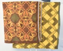 Two vintage midcentury wool blankets in warm yellows, orange and browns, comprising a brushed fleece
