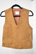 A 20th century vintage leather tank top or vest, in supple tan smooth leather with V neck, faux