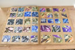 Two 20th century French fabric sample books, annotated by hand, together enclosing approximately 500