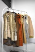 Assorted ladies waistcoats and jackets in faux fur, afghan and suedette styles, colours neutral