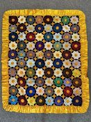 An antique garden quilt in silk, velvet, jacquard, satin and taffeta, featuring a gold theme with