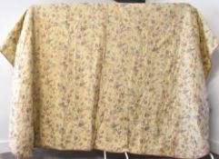 A 20th century vintage bedspread embroidered all over with butterflies and floral branches in