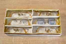 Six pairs of early-mid 20th century vintage eye glasses / spectacles, with gold tone metal frames,