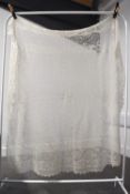 An early 20th century antique Scottish wool shawl, with a fine open knit and ornate weave
