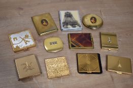 Assorted 20th century vintage compacts, French made or having a French theme, to include Eiffel
