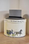An antique Scott & Co. top hat in pale grey fine felt, with black ribbon, in a large cream hat box