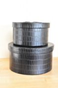 Two hat boxes or cosmetics cases, in black moc croc man-made leather, lined with black velveteen