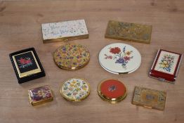 Assorted 20th century vintage floral themed compacts, music and make-up tool boxes, to include