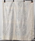 A 20th century vintage Indian embroidered bedspread or throw blanket, in cream cotton with powder