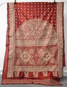 A 20th century vintage Sari, in rich iridescent burgundy with all over intricate floral hand-