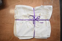 Three antique night dresses in white cotton, featuring various lace and crochet designs, one with