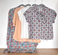 Three 20th century blouses to include a pussy-bow in cream, black and burgundy onrnate pattern, a