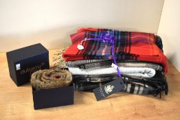 Five wool scarves and a shawl / poncho, to include Great Scot brand, in a range of colours and