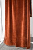 A 20th century vintage curtain, drape or hanging in heavyweight terracotta velvet, has hook fixing