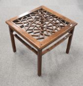 An Chinese elm table, of square section form with crazed open-work top over traditional design