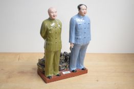 A Chinese Maoist/cultural revolution glazed bisque porcelain figure group, depicting Chairman Mao