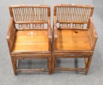 A pair of attractive 20th century Chinese bamboo armchairs, of traditional square section form