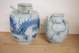 Two Chinese Qing dynasty blue and white pottery wine ewers, each of shouldered baluster form with