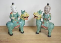 A pair of Chinese export famille verte figures of boys riding Qilin, 25cm one Qilin with depletion