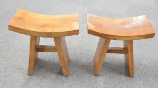 A pair of attractive Japanese elm stools, with concaved rectangular seats and simple splayed