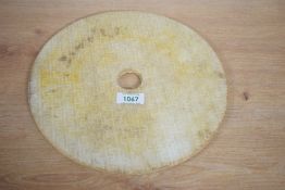 A large Chinese carved stone Bi/Yubi type disc, of circular form with central aperture, profusely