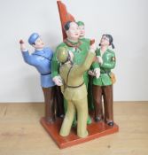 A Chinese Maoist/Cultural revolution coloured and glazed bisque porcelain figure group, depicting
