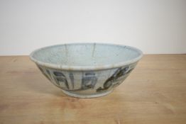 A Chinese glazed blue and white pottery bowl, possibly 18th century, of typical form with unglazed