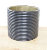 A Japanese lacquered wood planter, of turned cylindrical form with multiple 'ribs' enclosing a