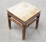 A Chinese hardwood side table, of square section form and of traditional design, having remains of