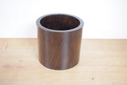 A turned Chinese rosewood (Dalbergia Odorifera) cylindrical container, 17cm x 19cm cracked to side