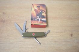 A 20th century Chinese 'Swiss Army' style muli-tool/bladed pocket knife in green with red star