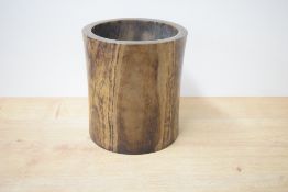 A turned Chinese rosewood container, of slightly waisted cylindrical form, 22.5cm x 20.5cm cracks