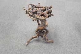 A decorative entwinded rootwood pedestal or stand, 60cm