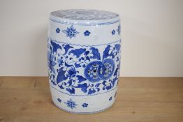 A Chinese hand-decorated blue and white pottery garden seat, of typical barrel form but small