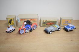 A group of four Chinese made tin plate wind-up vehicles, comprising a motorcycle, vintage sports