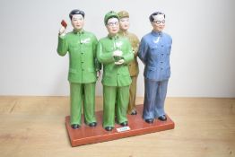 A Chinese Maoist/cultural revolution glazed bisque porcelain figure group, depicting four male and