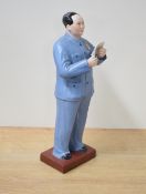 A Chinese Cultural Revolution/Maoist coloured and part glazed bisque porcelain figure of Chairman