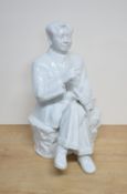 A Chinese Maoist/cultural revolution blanc-de-chine porcelain figure of Chairman Mao Zedong