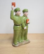 A Chinese cultural revolution porcelain figure group, depicting two red guards or soldiers proudly