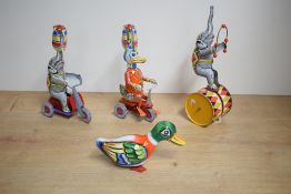 A Chinese made tin-plate wind-up circus elephant, dancing on double drum, key not present, sold