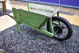 A large ornamental antique and later wooden garden barrow, possibly apple cart ?