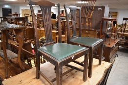 A set of six (four plus two) mahogany slat back dining chairs having drop in vinyl seats