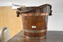 A vintage oak pail , with lid