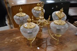 A modern gilt brass ceiling light fitting having five branches , with crackled glass shades