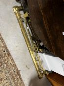 A brass Art Nouveau style fire fender