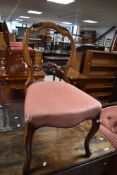 A 19th Century stained frame salon chair having overstuffed seat