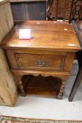 A nice quality reproduction oak side table having drawer and shelf under, height approx. 71cm