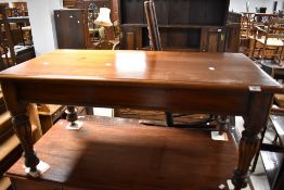 A modern mahogany coffee table in the classical style